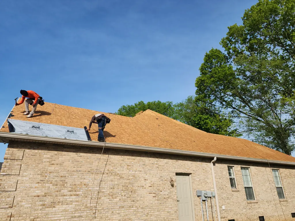 Legacy Construction crew installing roof decking on a Knoxville, TN home