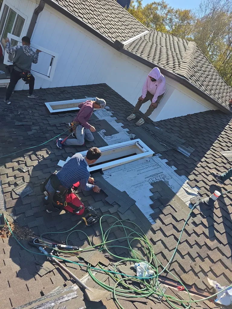 Legacy Construction roofing contractor at work