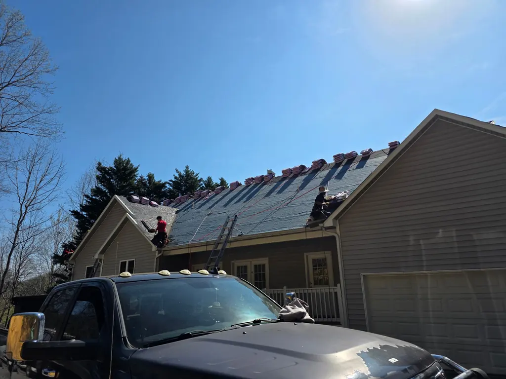 Shingle installation in progress on a residential roof